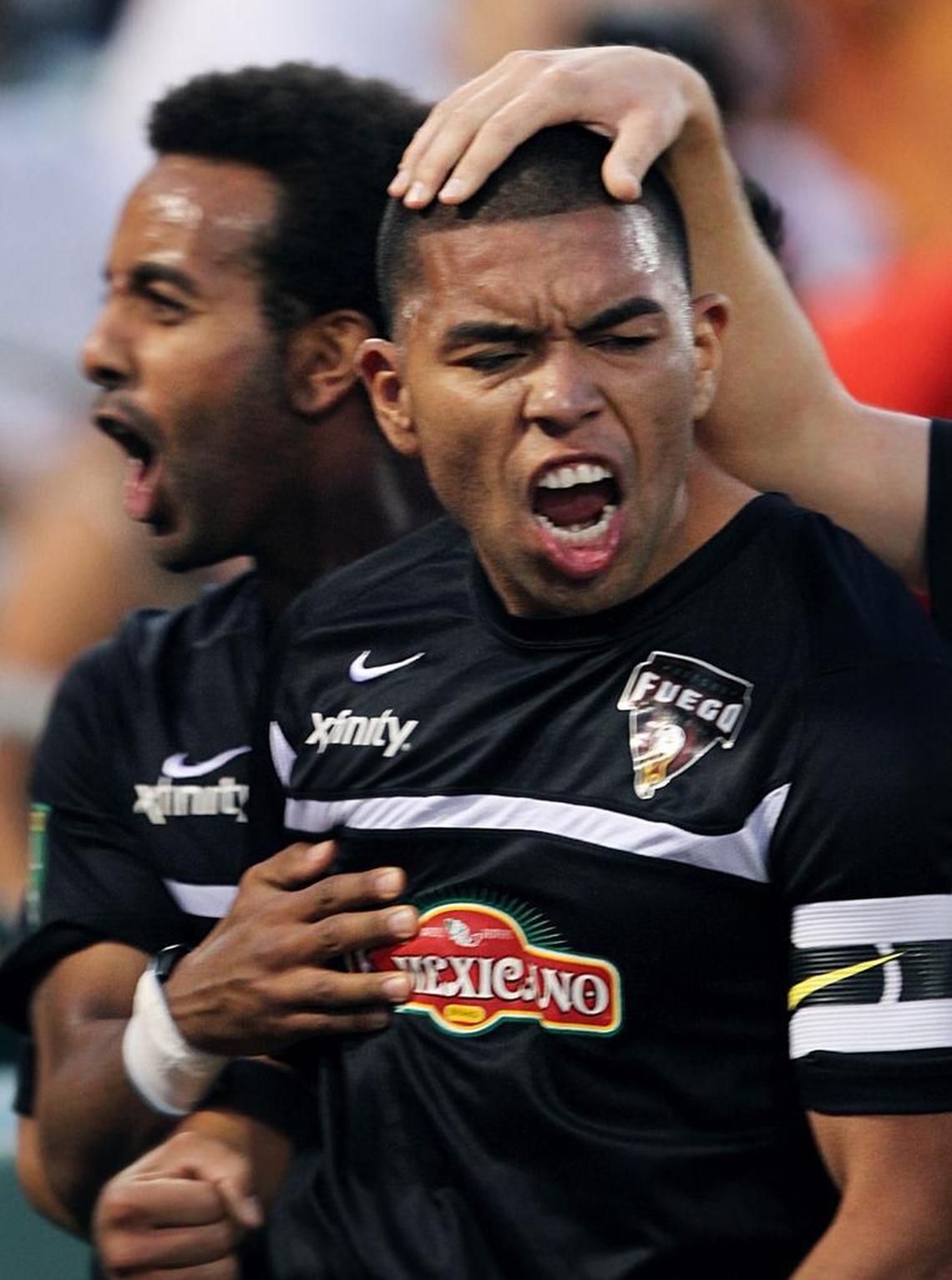 ERIC PAUL ZAMORA/THE FRESNO BEEFuego midfielder Milton Blanco, right, celebrates in frnot of fans after his goal in the second half tied the game 1-1 Saturday night. The Fresno Fuego played the Ventura County Fusion in Fresno, CA. June 11, 2011.
