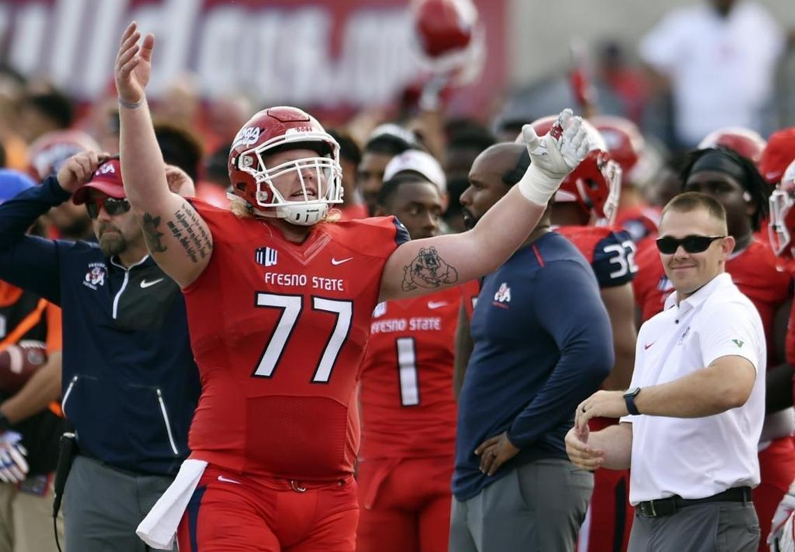 Fresno State’s Aaron Mitchell pumps up the crowd in second half action against Boise State Saturday, Nov. 25, 2017 in Fresno. Fresno State Won 28-17.