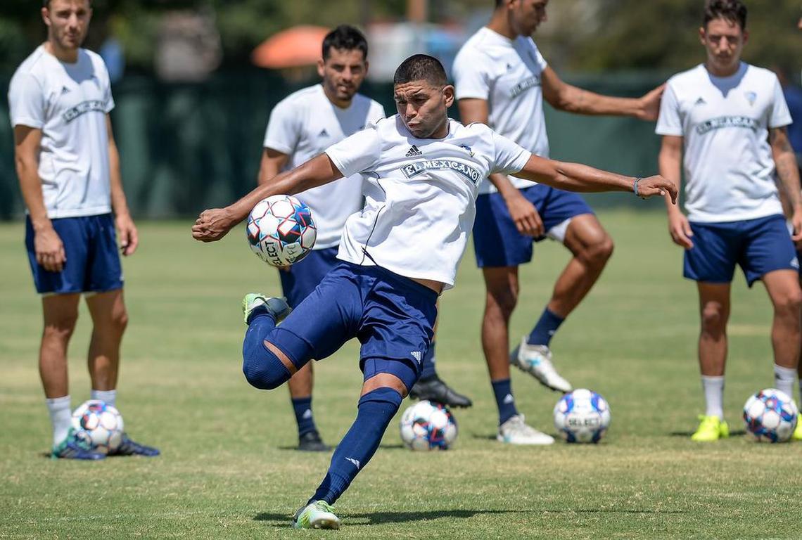 Fresno Foxes player Milton Blanco, center goes to strike the ball in a shot at the net while practicing with the team at Fresno City College on Thursday, July 12, 2018. 