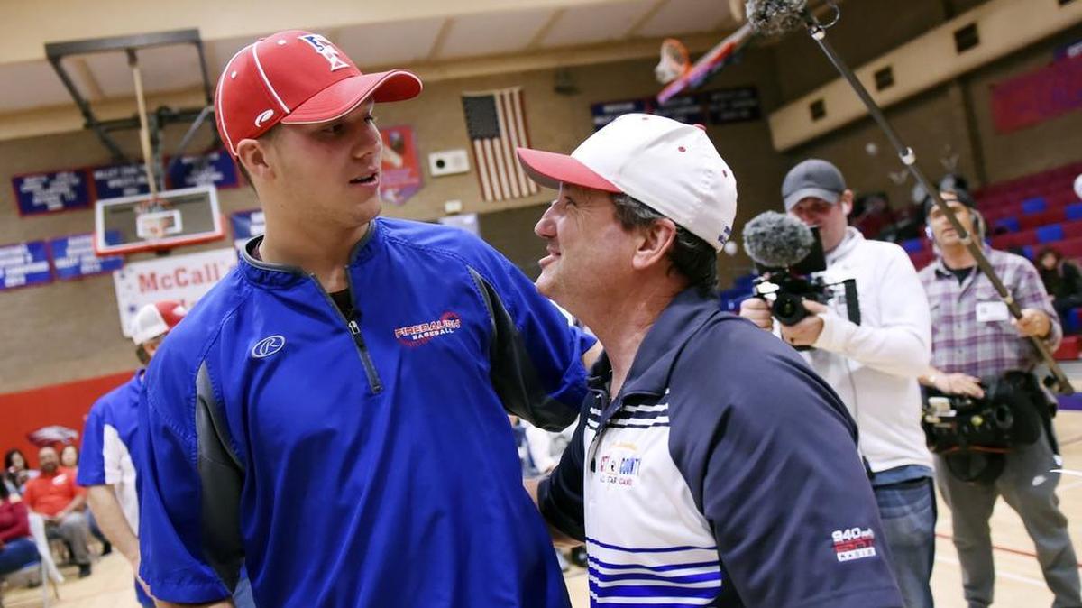 File photo of former Firebaugh High star quarterback Josh Allen with former coach Bill Magnusson before a rally Thursday afternoon, April 18, 2018 in the Firebaugh gym.
