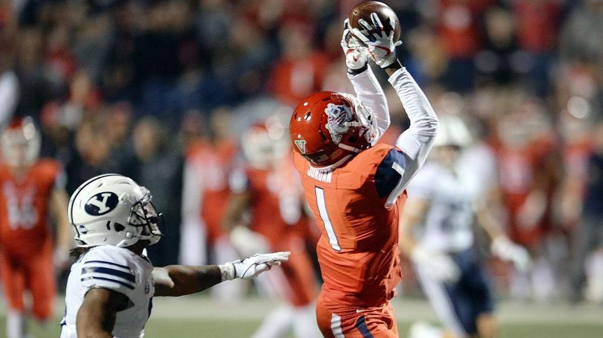 Fresno State’s Jamire Jordan, right, catches a 50-yard pass while defended by BYU's Dayan Ghanwoloku to set up first-and-goal during the first half of the Bulldogs’ 20-13 victory Saturday night.