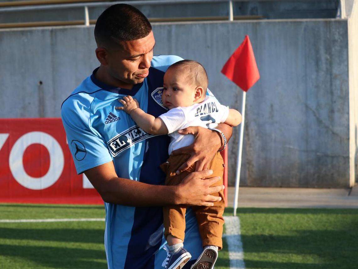 Fresno Foxes midfielder Milton Blanco craddles his infant son Stephen Xander during pregame introductions prior to the team’s U.S. Open Cup match at Lamonica Stadium on May 16, 2018