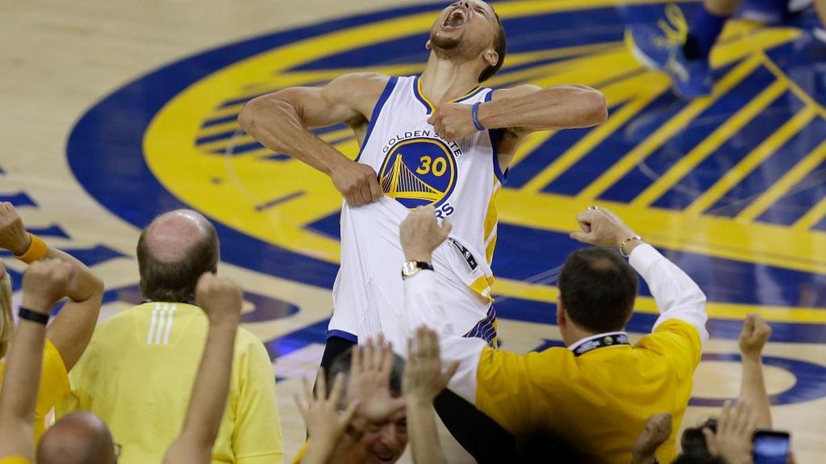 Fans cheer as Golden State Warriors guard Stephen Curry yells after the Warriors beat the Oklahoma City Thunder in Game 7 of the NBA basketball Western Conference finals on Monday, May 30, 2016. The Warriors won 96-88 to complete a comeback from a 3-1 deficit in the series.