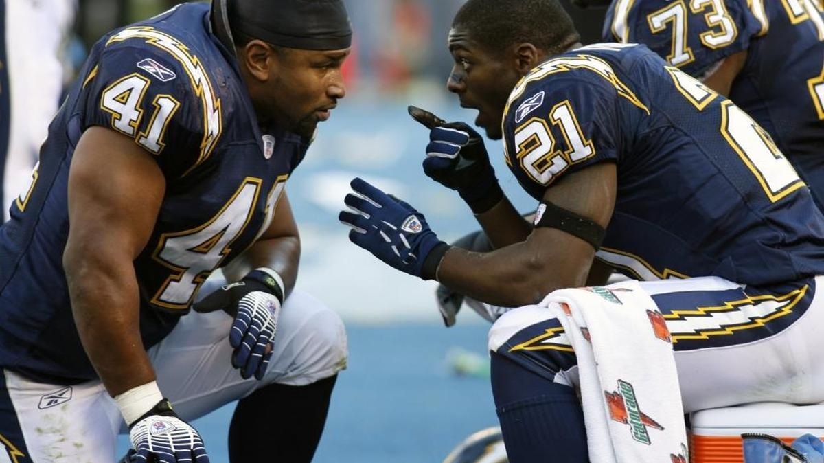 San Diego Chargers running back LaDainian Tomlinson, right, talks with fullback Lorenzo Neal during the 2007 AFC divisional-round playoffs. It followed a regular season in which Tomlinson broke the NFL record by scoring 31 touchdowns, many of them with Neal as his lead blocker.