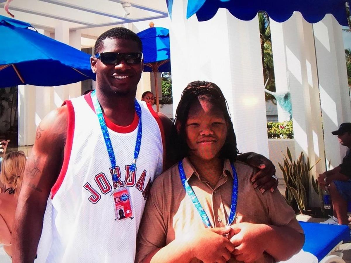 LaDainian Tomlinson and Twila Neal, the younger sister of Lorenzo Neal, pose in a 2006 photo taken at the Pro Bowl in Hawaii while Tomlinson and Neal were teammates on the San Diego Chargers.