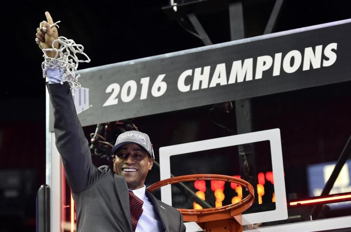 Fresno State men’s basketball coach coach Rodney Terry holds up the net in celebration of the Bulldogs’ 68-63 victory over San Diego State in the championship game of the 2016 Mountain West Conference tournament