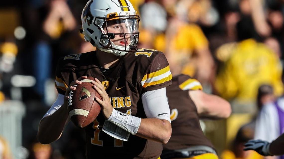 Wyoming quarterback Josh Allen looks downfield during an October 2016 game against Air Force at War Memorial Stadium. The Firebaugh native had no Division I offers out of high school and two after one semester of junior college. Now the redshirt sophomore is being touted as an early round NFL draft pick.
