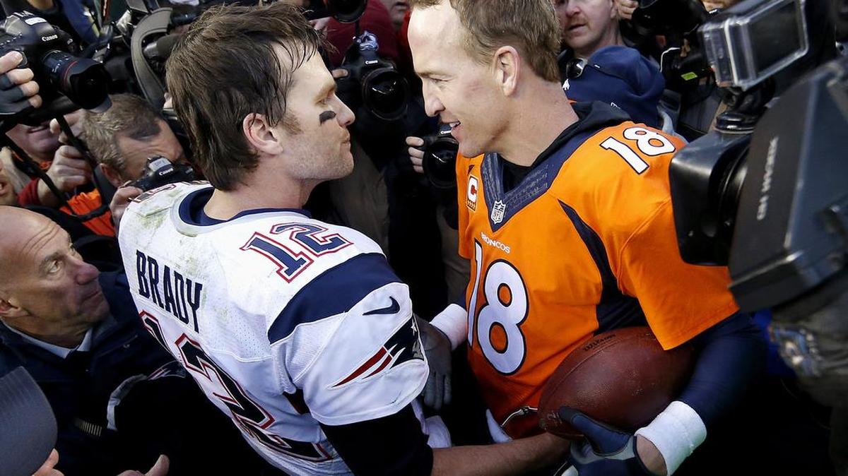 New England Patriots quarterback Tom Brady, left, and Denver Broncos quarterback Peyton Manning speak to one another following the AFC Championship game on Sunday, Jan. 24, 2016, in Denver. The Broncos defeated the Patriots 20-18 to advance to the Super Bowl.