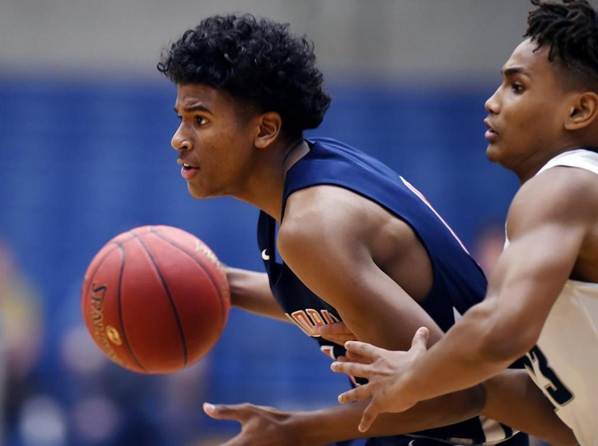 Memorial High standout Jalen Green, left, drives past Clovis East’s Jermal Pittman during a Jan. 5 nonleague game in Clovis. With at least 15 scholarship offers, Green is ranked as the nation’s No. 1 recruit in the class of 2020.