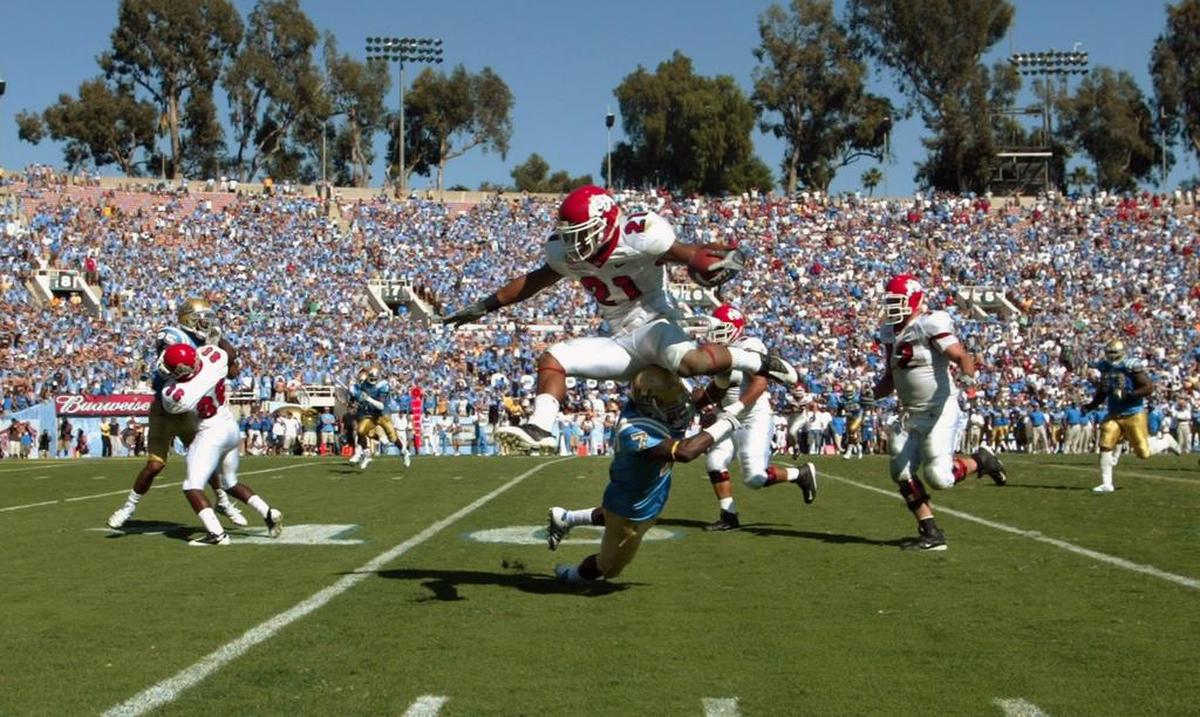 Fresno State’s Ryan Mathews leaps over UCLA defender Courtney Viney in the most memorable play from the Bulldogs’ victory over the Bruins in 2008.