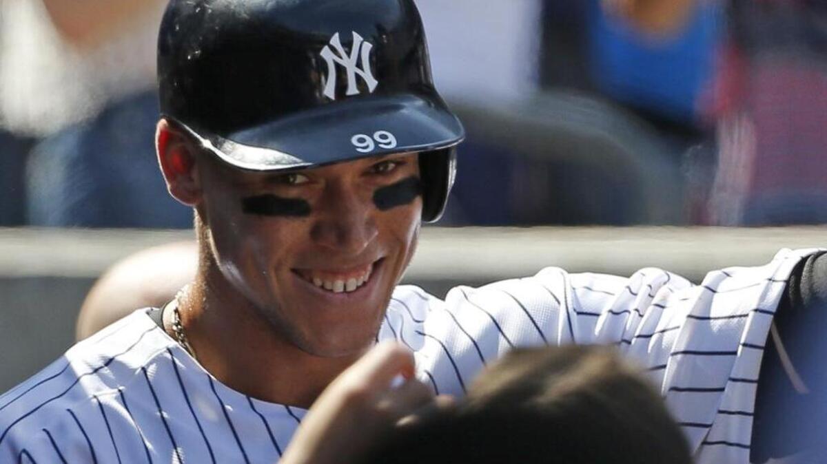 In what has become a familiar sight, Aaron Judge smiles as he greets teammates in the New York Yankees dugout following a home run during what’s been a stupendous rookie season.