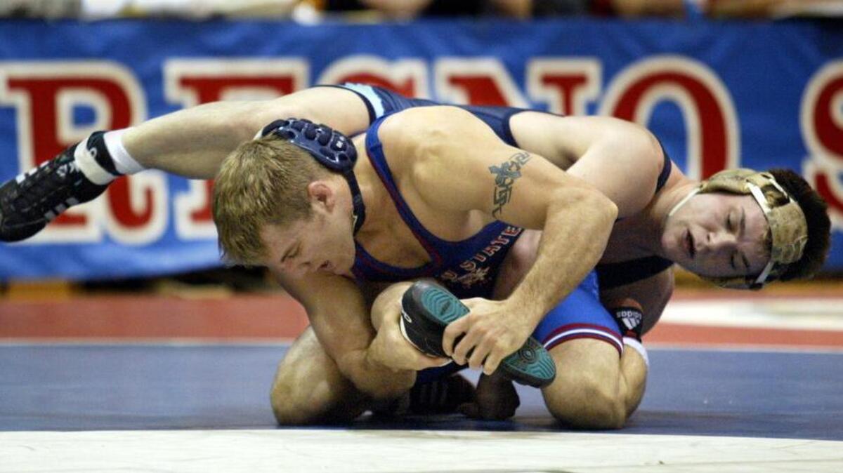 It’s been over a decade since Fresno State has hosted the likes of former Bulldog Casey Olson, at bottom shown in 2004, for a wrestling meet. While the sport is on its way back after it was cut in 2006 and women’s water polo is being added, the athletic department is already a facing financial strain with their additions.
