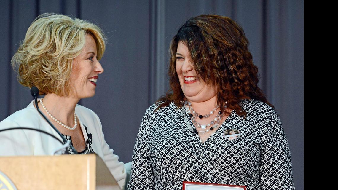 
Fresno mayor Ashley Swearengin, left, presents Stacey Gonzales with a key to the city. Gonzales is the mother of 9-year-old Janessa Ramirez, who was killed in gang crossfire last January.
