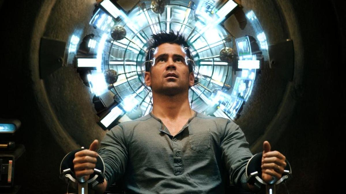Quaid (Colin Farrell) seated in the Mind Trip Chair inside the Rekall Tripping Den in Columbia Pictures' action thriller “Total Recall.”