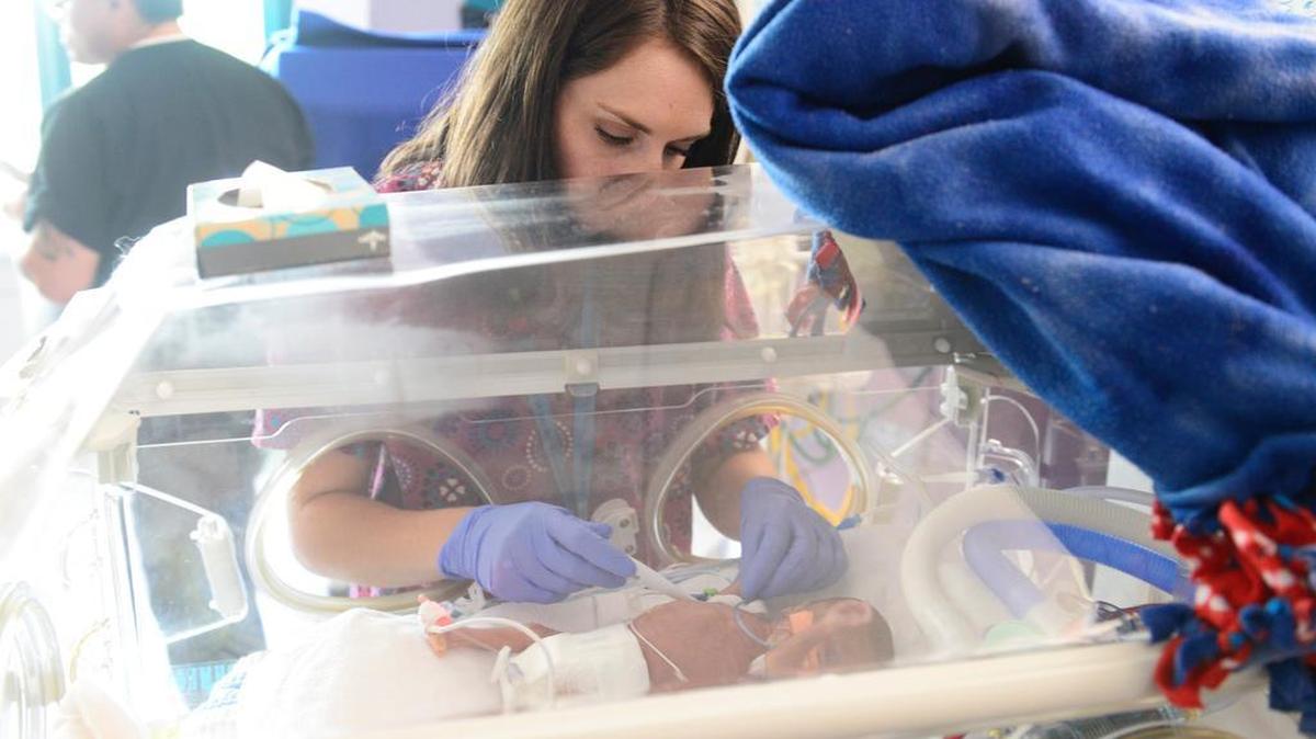 
Registered nurse Kristi De Young checks on a baby in the neonatal intensive care unit at Valley Children’s Hospital.
