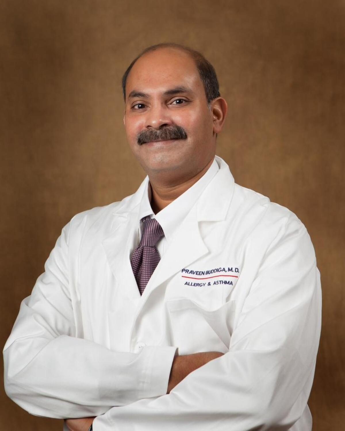 Dr. Praven Buddiga