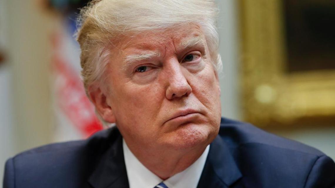 In this Monday, March 13, 2017 photo, President Donald Trump listens during a meeting on health care in the Roosevelt Room of the White House.