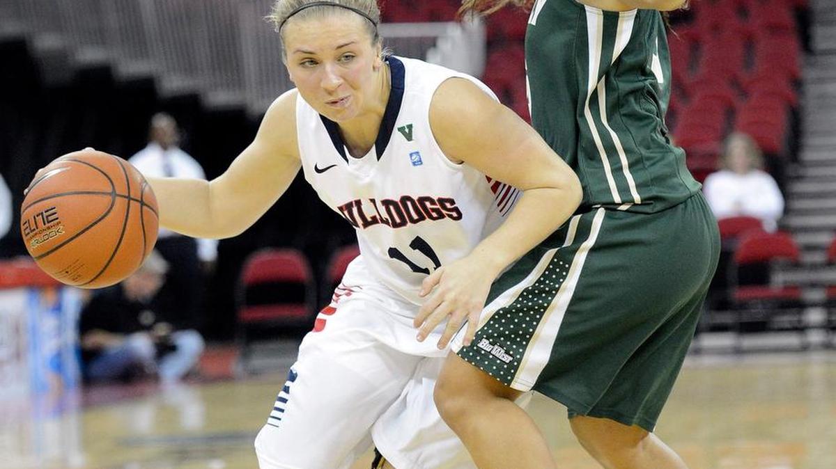 
Fresno State’s Alex Furr, left, drives around Cal Poly’s Ariana Elegado in the first half of their season opener at the Save Mart Center last November.
