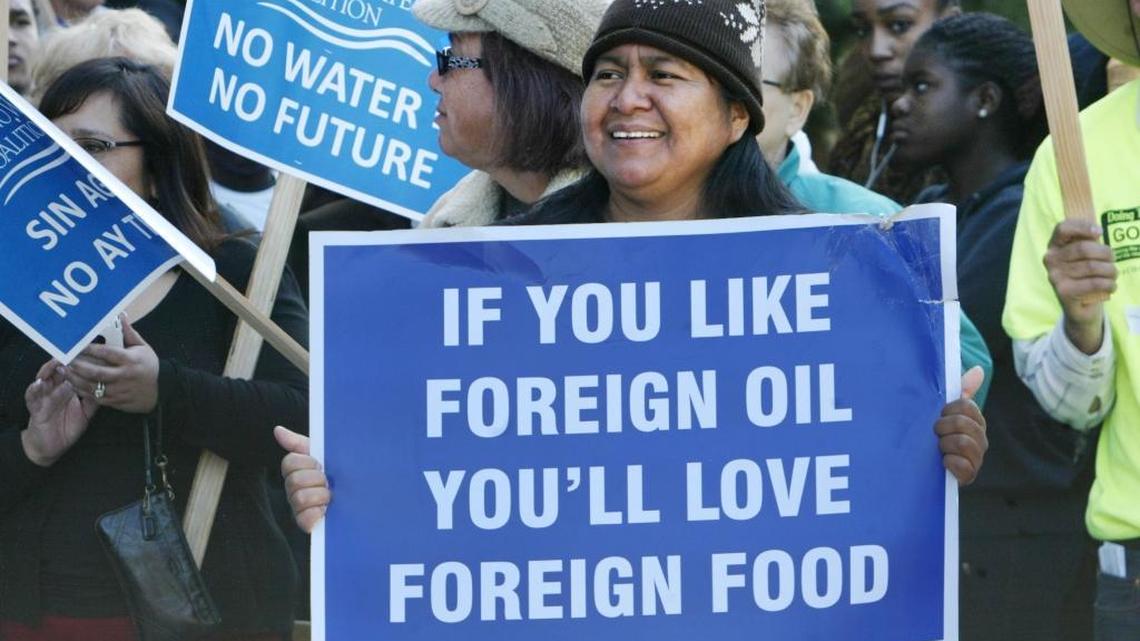 A supporter waves her sign as she participates in a 2014 rally in Sacramento to bring more water to the parched San Joaquin Valley.