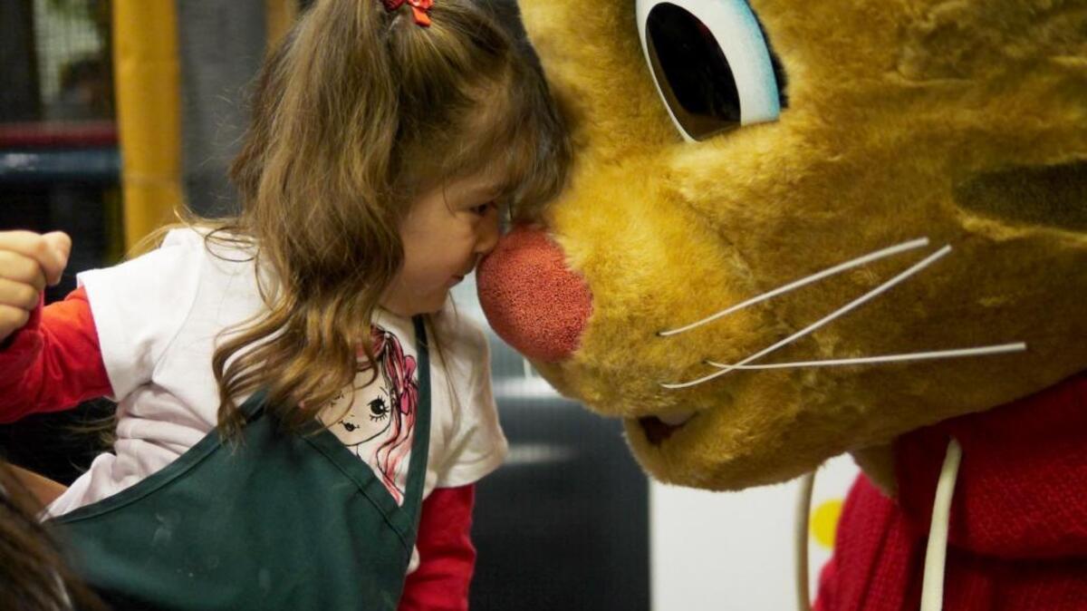 Young ValleyPBS Family Circle member goes nose-to-nose with Daniel Tiger, a cartoon character in PBS Kids “Daniel Tiger’s Neighborhood.”