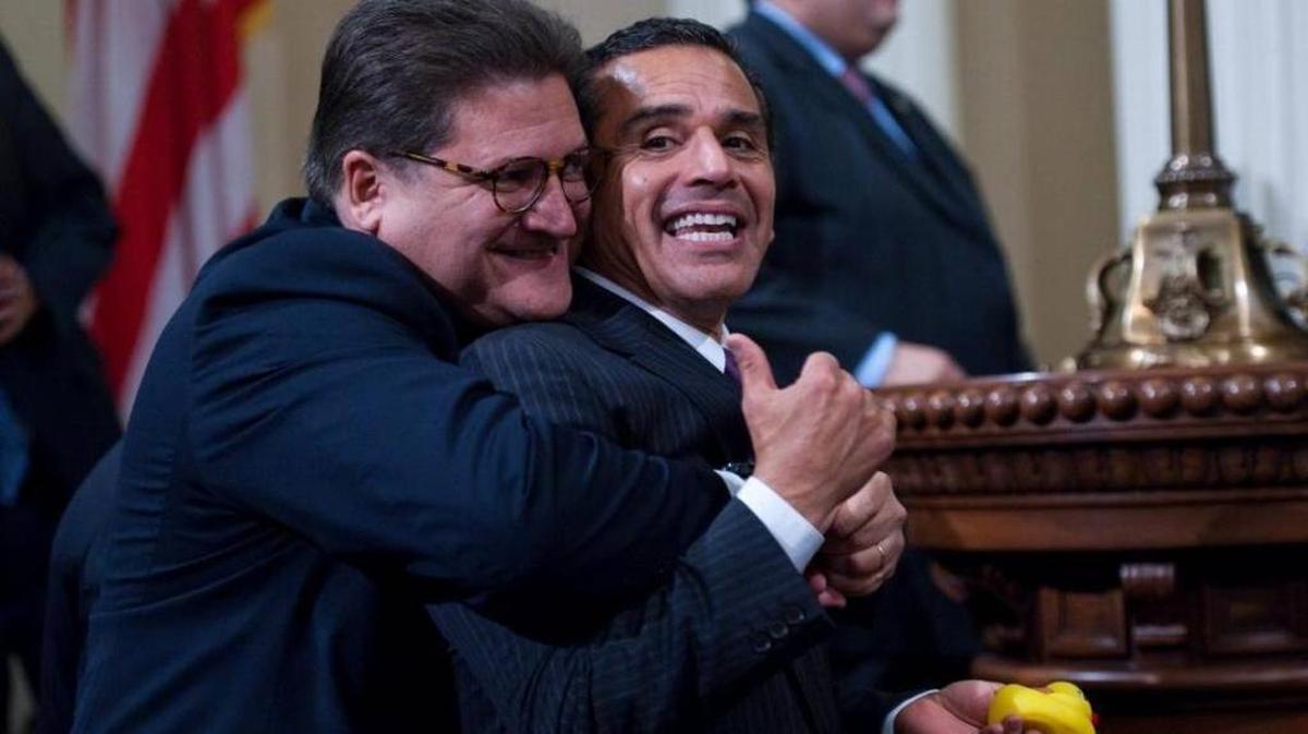 Robert Hertzberg gives Los Angeles Mayor Antonio Villaraigosa, a hug during a 2010 swearing-in at the state Capitol.