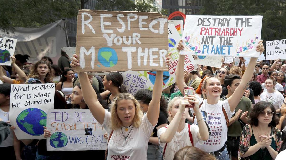 Protesters rally on the Federal Plaza inside Chicago’s famed Loop during a global climate change march Friday, Sept. 20, 2019. Throughout the world Friday, young people banded together to demand that world leaders headed to a United Nations summit in New York step up their efforts to combat climate change.