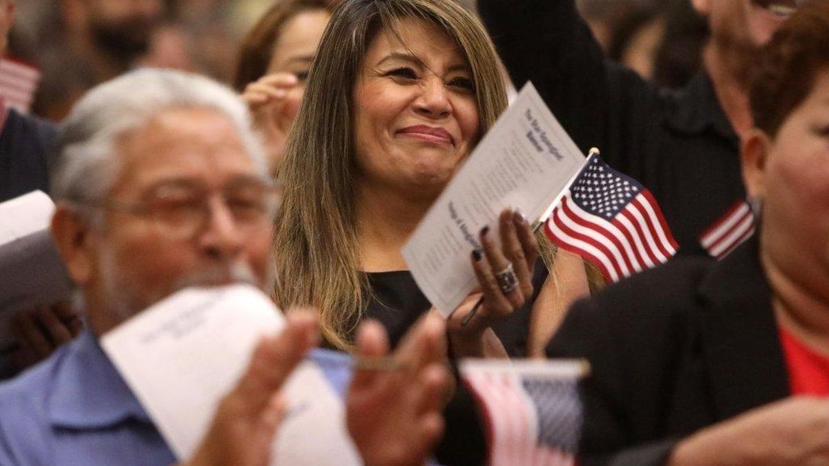 María Solorio – orginally from Guadalajara, Jalisco, México – applauds after taking the oath of naturalization during Aug. 21 ceremony. The 50-year-old Fresno resident works for a janitorial company that is in charge of cleaning the offices of the Fresno field office of the Citizenship and Immigration Services.