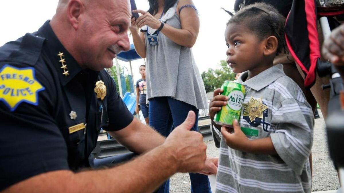 Fresno police Chief Jerry Dyer gives a thumbs-up to 4-year-old KEJohon Thomas during the department’s observance of National Night Out last summer. Dyer is putting a focus on youth by developing the Police Chief’s Youth Advisory Council.