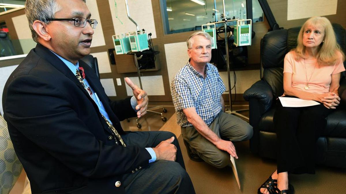 Fresno oncologist Ravi Rao, left, with patient Norma Smith and her husband Rod, voices his frustration in working with pharmacy benefit managers in treating his patients.