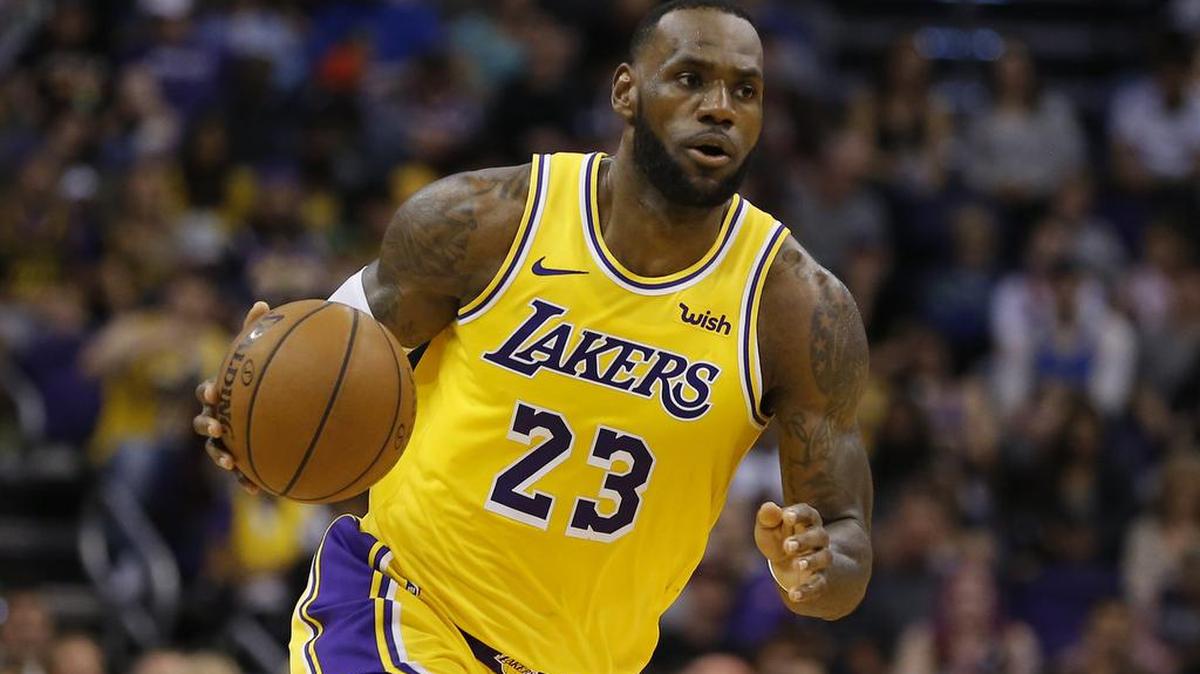 Los Angeles Lakers forward LeBron James during an NBA basketball game against the Phoenix Suns in Phoenix. That LeBron James jersey could get a little more expensive. Companies that make clothing and shoes for the National Basketball Association players are in the crosshairs of President Donald Trump's escalating China trade wars.