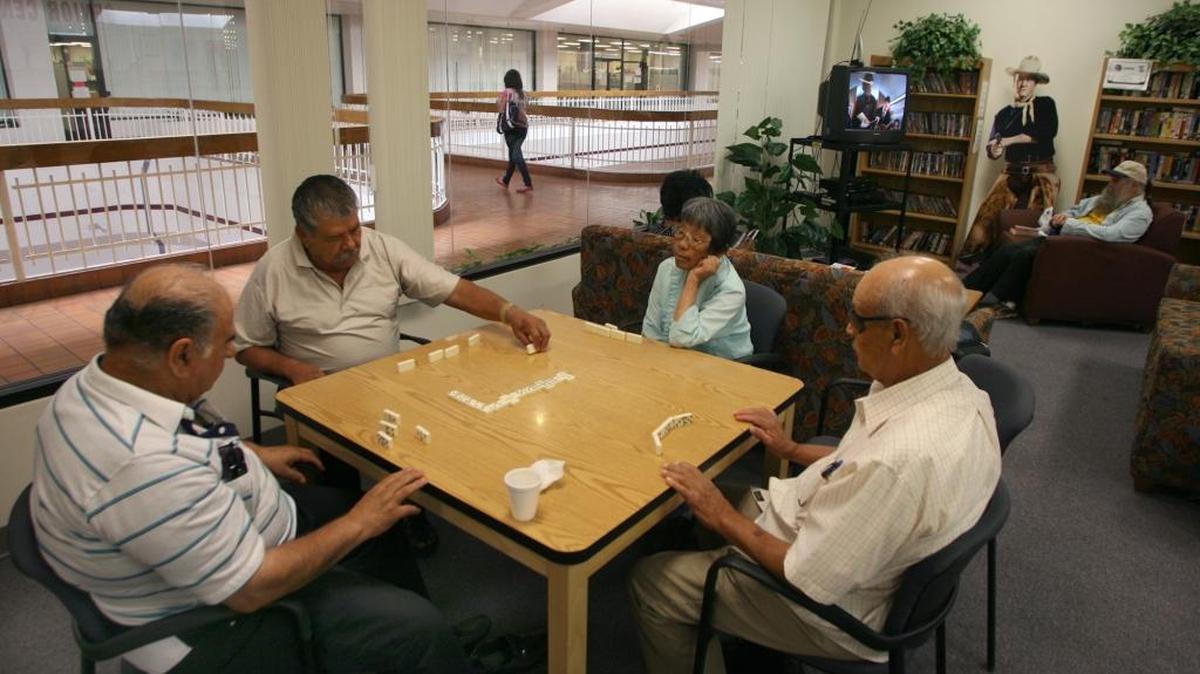 In this July 14, 2010 photo, a game of dominos is played at the senior center at Manchester Center. There no longer is a room at Manchester where seniors can sip coffee, go online, chat, play games and read the newspaper. Options are few for Fresno’s older population, as California’s fifth-largest city does not have a municipal seniors center.