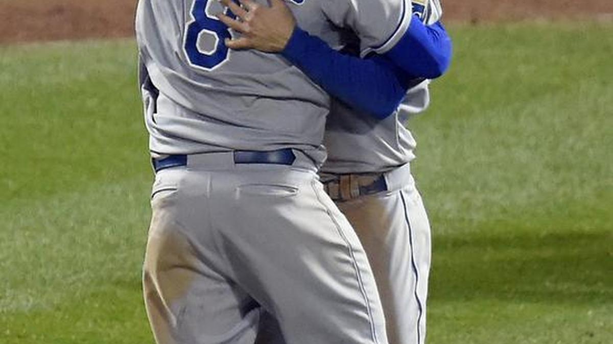 Kansas City Royals first baseman Eric Hosmer and third baseman Mike Moustakas celebrate after the Royals defeated the New York Met 7-2 to win the World Series on Nov. 1 at Citi Field in New York.