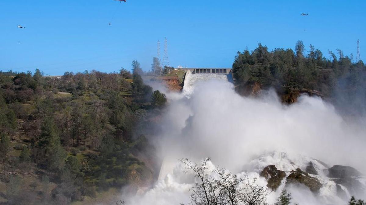 Helicopters move boulders onto the damaged emergency spillway of Oroville Dam on Feb. 14.