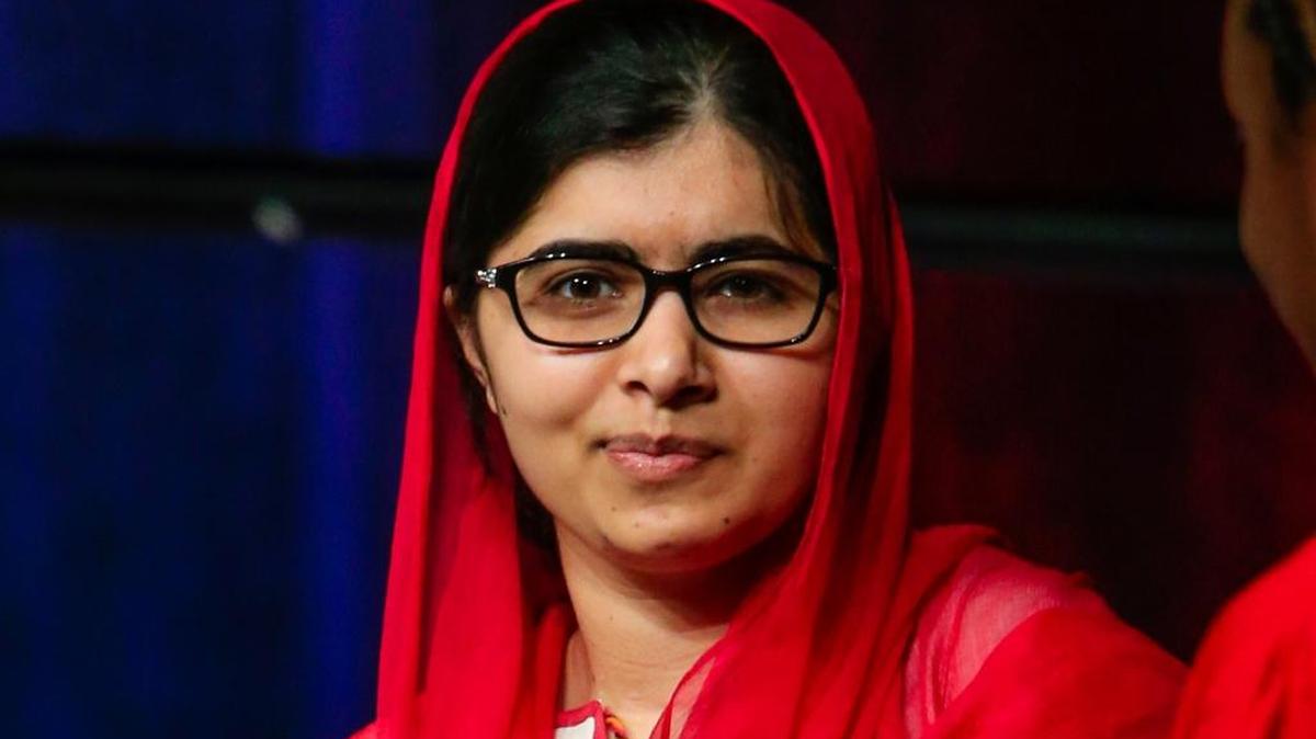 Malala Yousafzai chats with panelists on stage at a benefit lunch for Girls Inc., a nonprofit organization whose mission is giving confidence to girls, in Omaha, Neb.