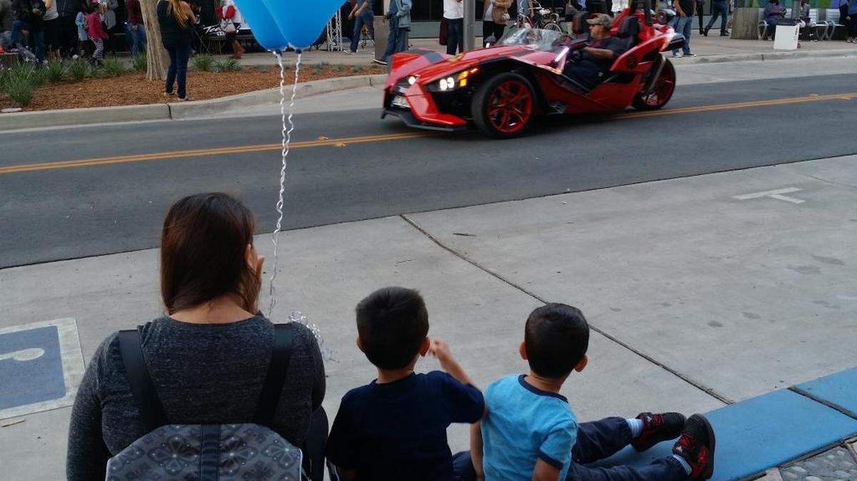Susie Tateosian and her children 3-year old Joseph and 2-year old Arthur watched the parade celebrating the opening of Fulton Street..