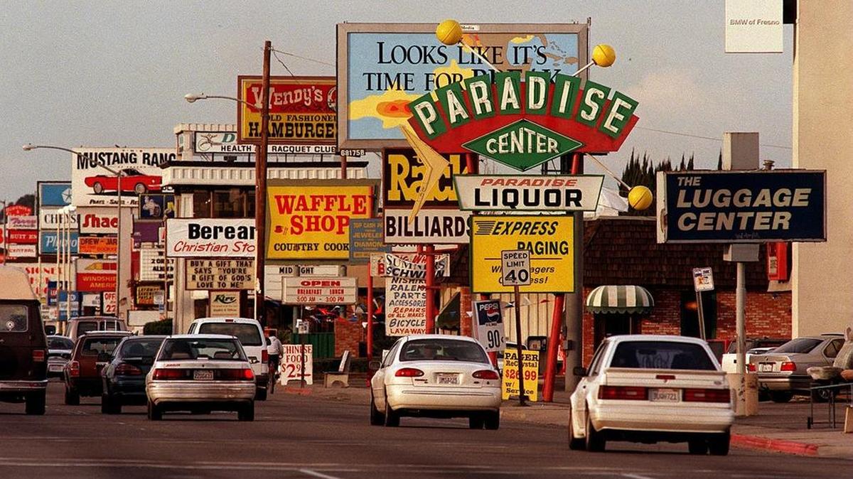 This file photo shows the concentration of shops along Blackstone Avenue in Fresno. A new effort is underway to redesign Blackstone so it can be a healthier roadway by accommodating bike paths and other uses.