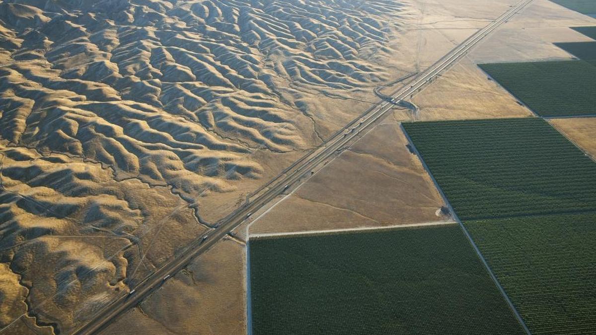 Irrigated fields in Westlands Water District border Interstate 5 and the Diablo Range west of Tranquility on June 12, 2015. Westlands is the nation’s largest agricultural water district.