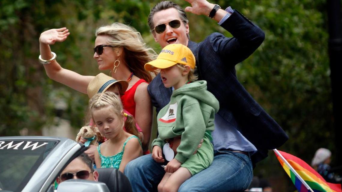 California Lt. Gov. Gavin Newsom rides in the San Francisco Pride Celebration and Parade with his wife, Jennifer Siebel Newsom, and their children last June in San Francisco. Newsom was mayor of San Francisco 11 years ago when he allowed same-sex marriages, a controversial decision that led to the Supreme Court ruling of June 26. However, his stand on gun control is at odds with Nicki Stallard, who says in an essay that the LGBT feels a need to protect themselves.