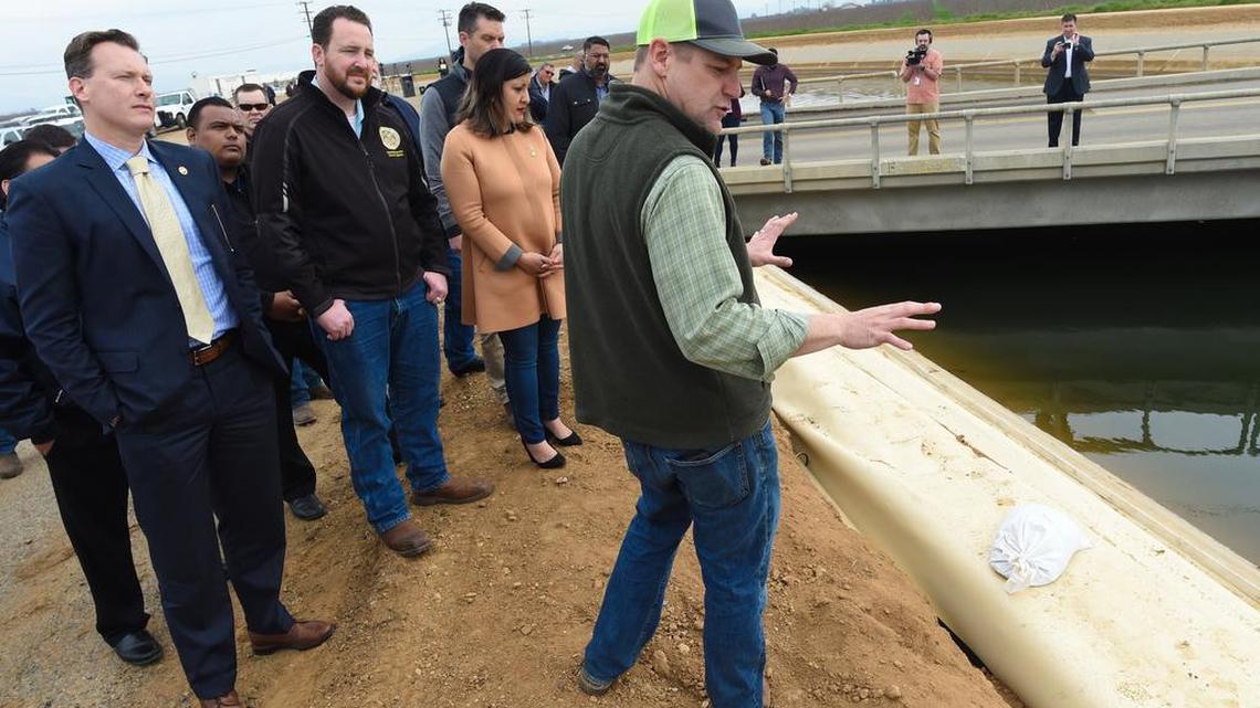 Douglas Deflitch of the Friant Water Authority points out repair work underway to a section of the Friant-Kern Canal, as from left, state Sen. Andreas, Assembly Member Devon Mathis, and state Sen. Melissa Hurtado look on during a tour near Terra Bella last March.