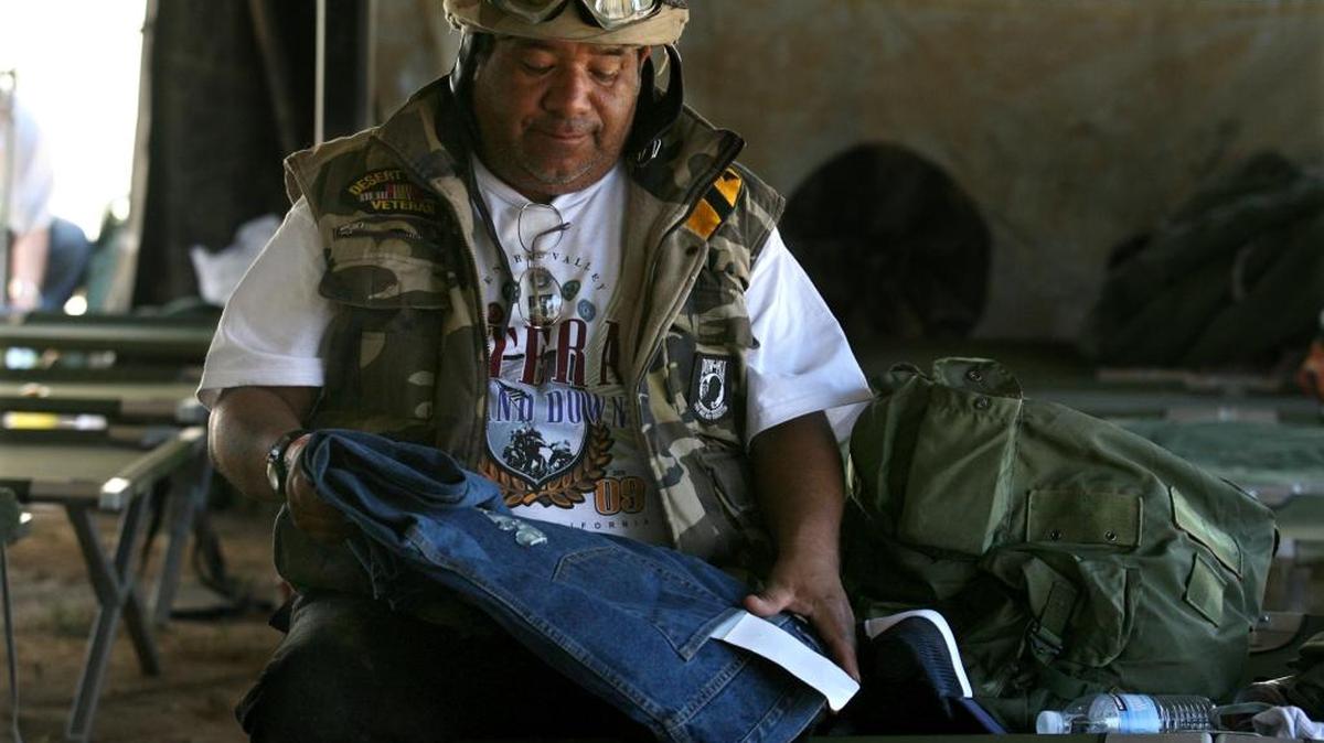 Arthur Casares, a homeless Desert Storm Army veteran admires his new pair of jeans during the Central Valley Veterans Stand Down in 2009 at VFW Post 8900 in Fresno. Only half of California’s 58 counties offer veterans’ treatment courts, which help struggling veterans fully rejoin society. AB 1672 would study the effectiveness of veterans’ court and open the door to their expansion.