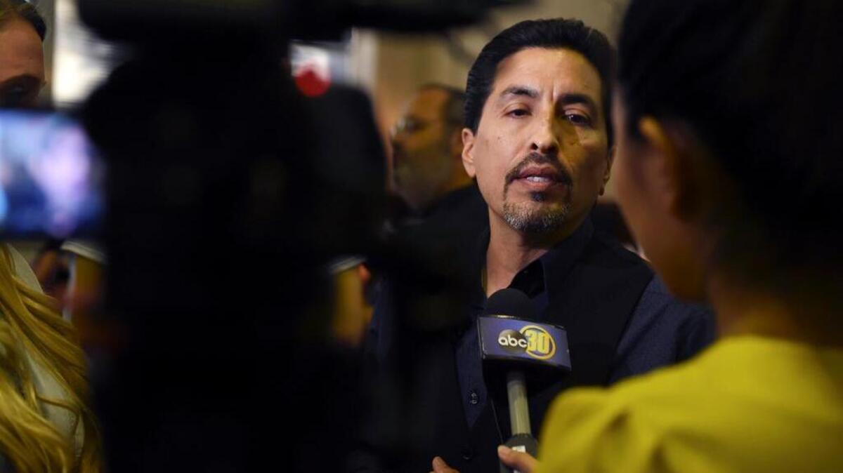 Fresno Unified School District board member Christopher De La Cerda speaks to the media after arguments broke out among board members Wednesday. The Rev. Karen Stouffer-Pugh suggests he would be a better board president than the current leader.