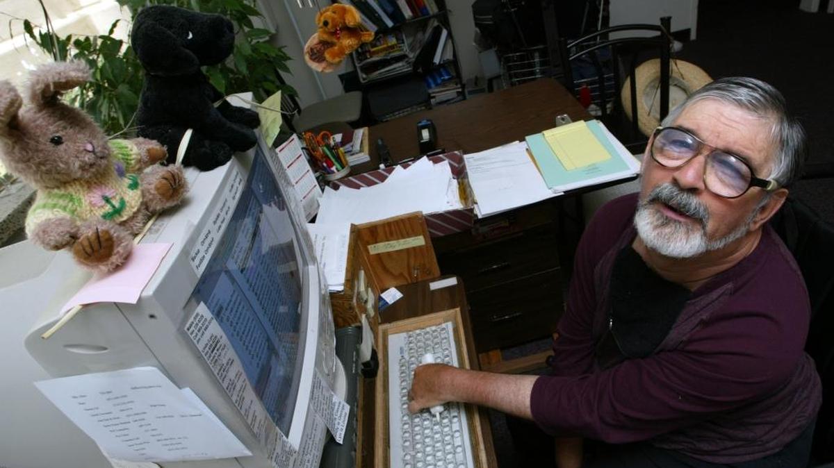 Joe Hemphill at his computer workstation at home where he writes his letters.