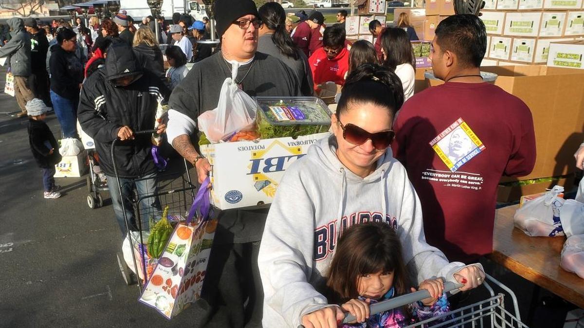 In January 2014, families lined up during the annual Kaiser Permanente food distribution, honoring the legacy of the late Rev. Dr. Martin Luther King Jr. at Manchester Mall, where officials distributed more than 40,000 pounds of food to needy military families and veterans. Some had waited in line since 5 a.m. for the start of the giveaway around 9:30.