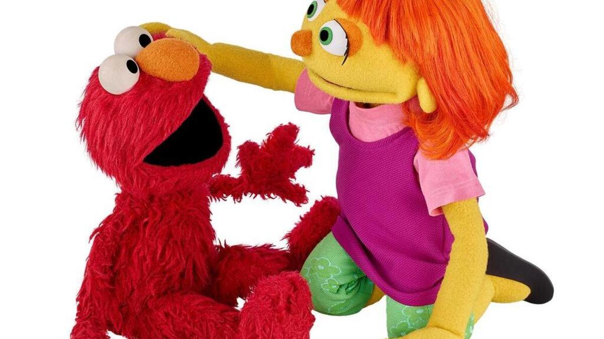 Julia, right, is a new ‘Sesame Street’ character who lives with autism.