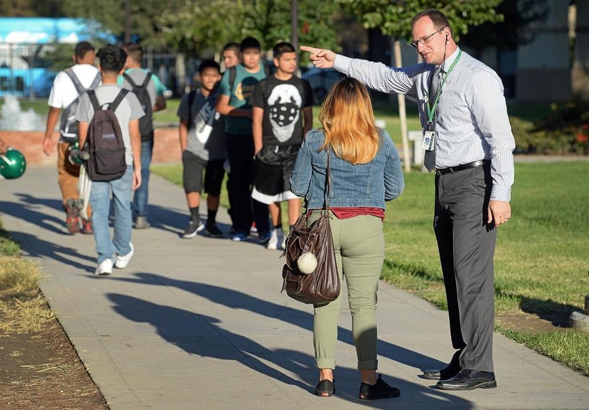 Roosevelt High School Principal Michael Allen directs students around campus before classes on the first day of school last August. Former county superintendent of schools Larry Powell says the Fresno Unified School District has a chance to remake itself into a district ready for the challenges of the digital age.