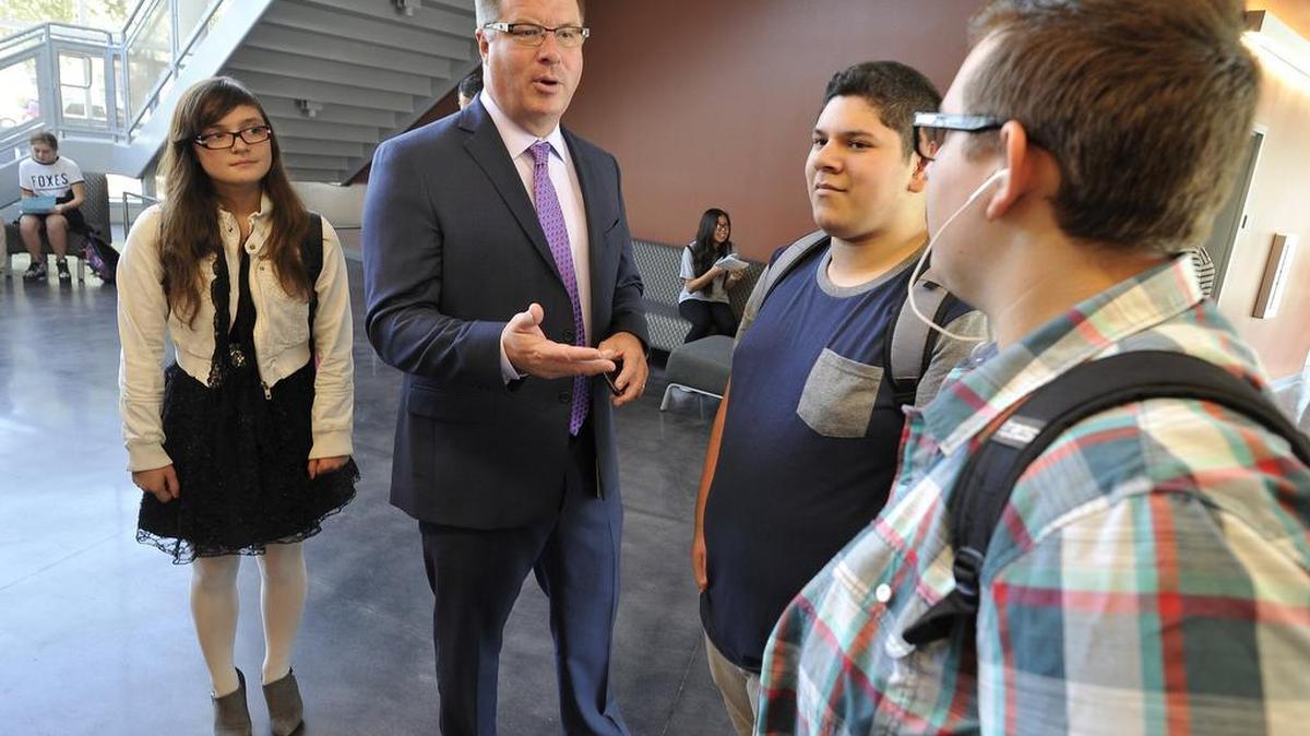 Fresno Unified Superintendent Michael Hanson chats with students on the first day of classes at the new Phillip J. Patiño School of Entrepreneurship in August.