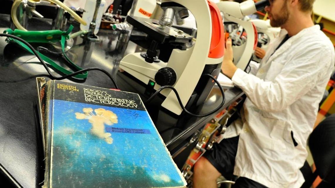 Student Christian Luscomb, right, works on an experiment in the aging Math and Science Building at Fresno City College. The $485 million Measure C bond on the June 7 ballot proposes to replace aging facilities and build new ones throughout State Center Community College District.