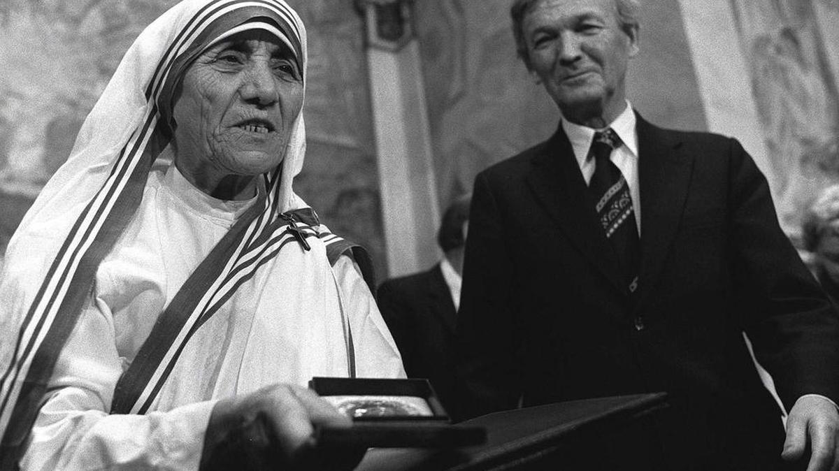 In this Dec. 10, 1979 file photo, Mother Teresa receives the Nobel Peace Prize during a ceremony at Oslo University. At right is the Chairman of the Norwegian Nobel Committee, Professor John Sanness.