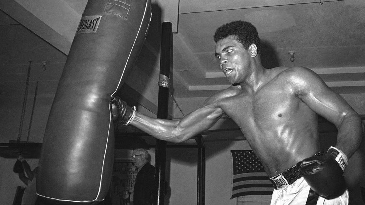 Muhammad Ali pounds away at the bag in Miami Beach, Fla., in 1970.