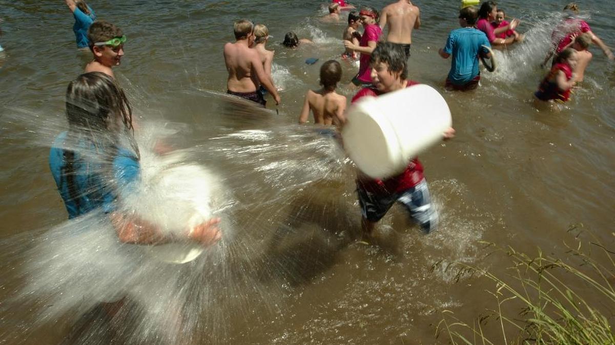 River Campers battle each other in a water war during swim time at Scout Island’s River Camp run through the San Joaquin River Parkway and Conservation Trust. The Parkway offers education, recreation and flood control all in one beautiful package.